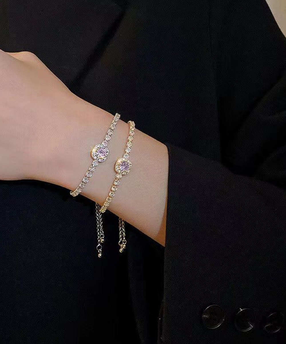 ゴールド煌めく円形ビジューバングル調節可能