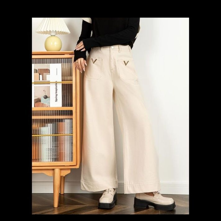 ベージュパンツ 金属装飾付きゆったりフレア脚長パンツ