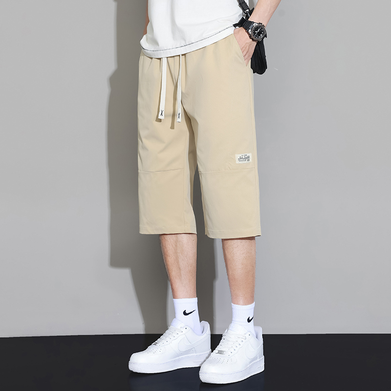 ベージュパンツ 調整紐付きゆったりフィット七分丈カーゴハーフパンツ