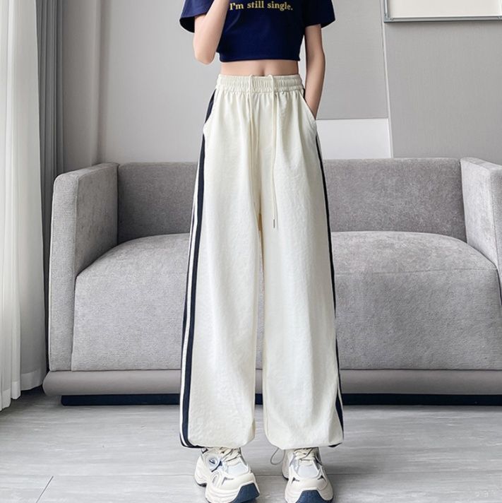 フレアパンツ ゆったりサイドライン入りフレアパンツ