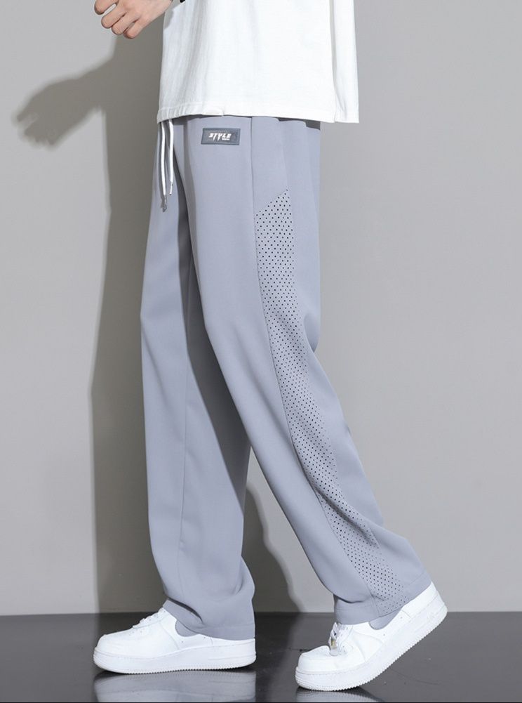 グレー パンツ サイドライン入りメッシュパネルワイドスウェットパンツ