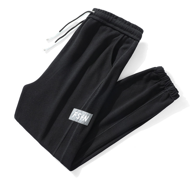 グレーパンツ 裾絞りワンポイントロゴ入りゆったり裏起毛 スウェット