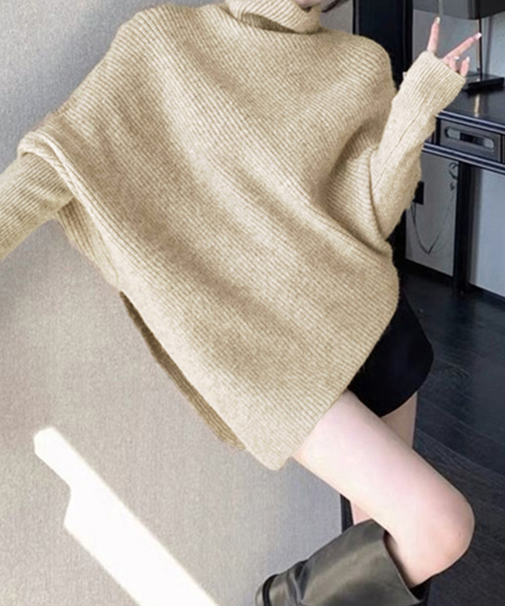 50代ファッション ハイネック変形ニット 斜めカット不規則裾