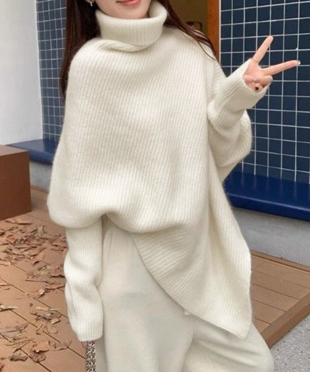 50代ファッション ハイネック変形ニット 斜めカット不規則裾