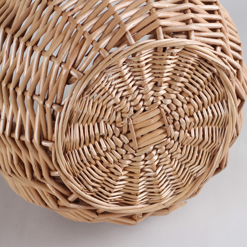 カゴバッグ 手編み籐素材の丸型ハンドバッグ