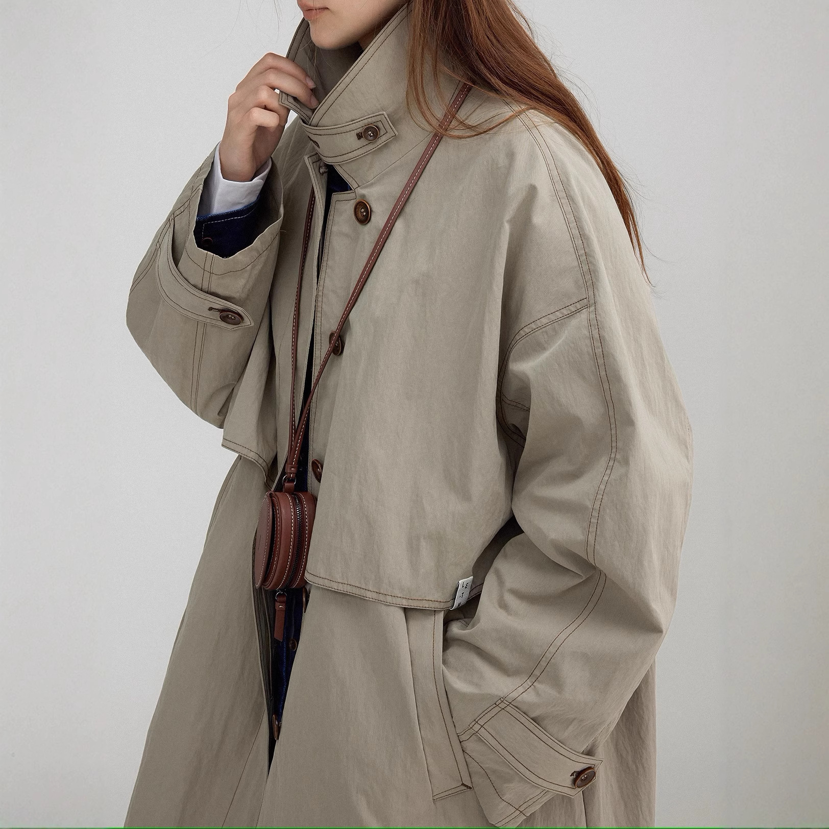 レディースカジュアルファッション 配色ステッチ スタンドカラー ロング丈コート