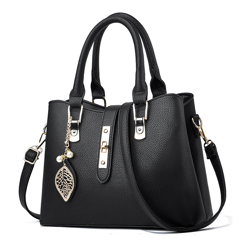 革バッグレディース 葉型チャーム付き上品な二重取っ手革バッグ