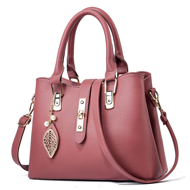 革バッグレディース 葉型チャーム付き上品な二重取っ手革バッグ