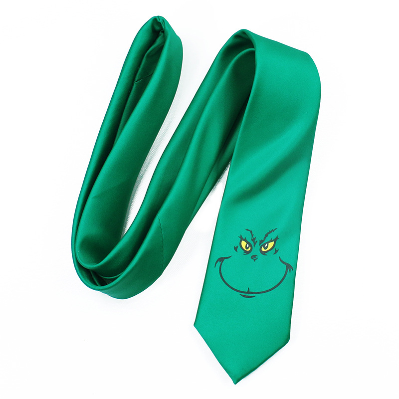 ネクタイ緑いたずらっぽい笑顔刺繍入り遊び心溢れる