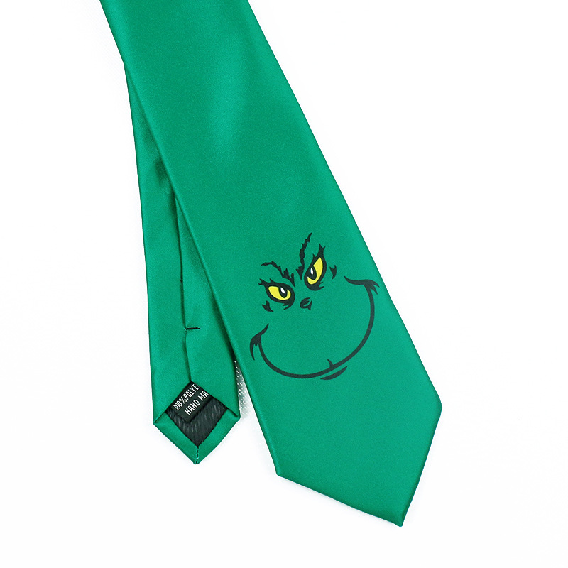 ネクタイ緑いたずらっぽい笑顔刺繍入り遊び心溢れる