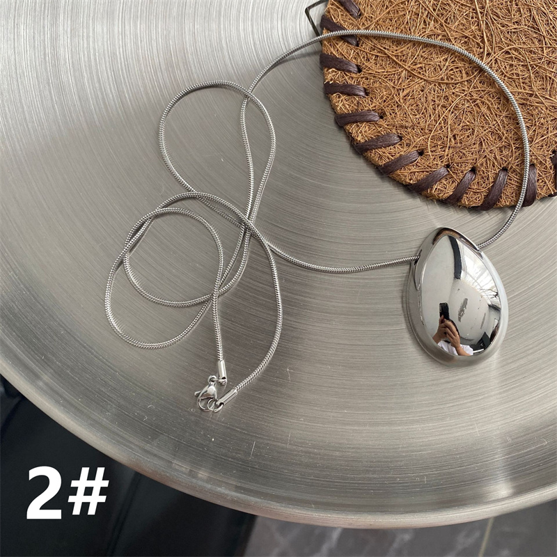 ペア アクセサリー 楕円形ペアネックレス 錆びにくい高級感首飾り
