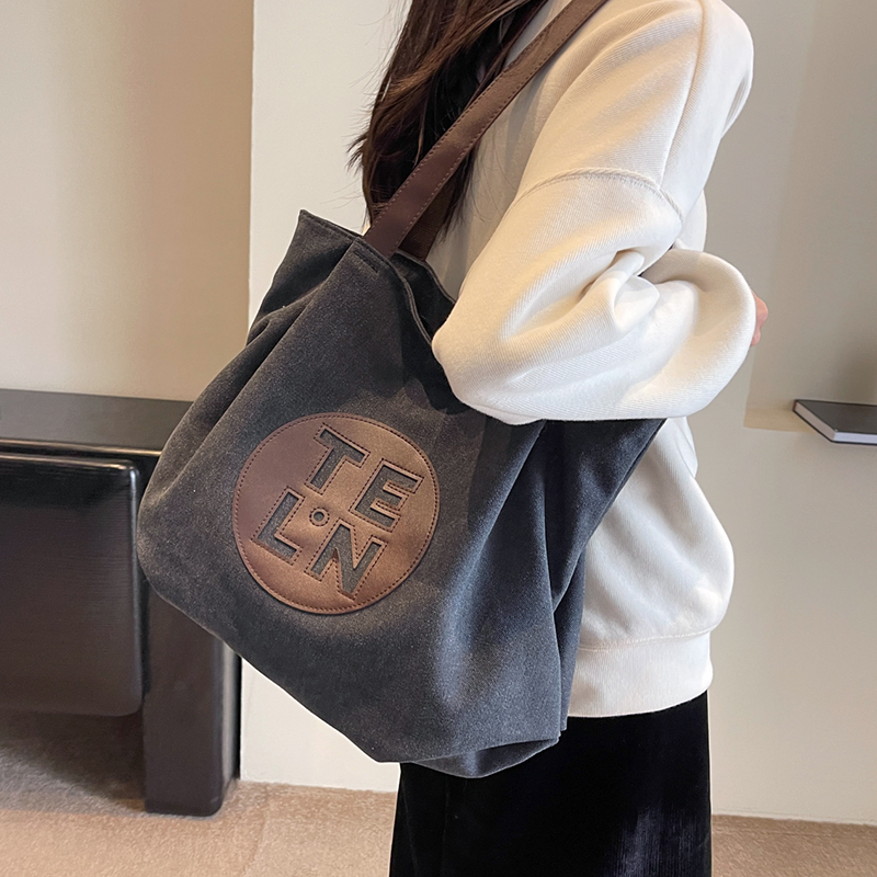 旅行バッグ 円形ロゴ入り帆布トートバッグ