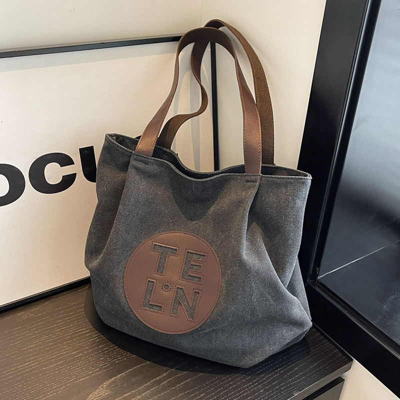 旅行バッグ 円形ロゴ入り帆布トートバッグ