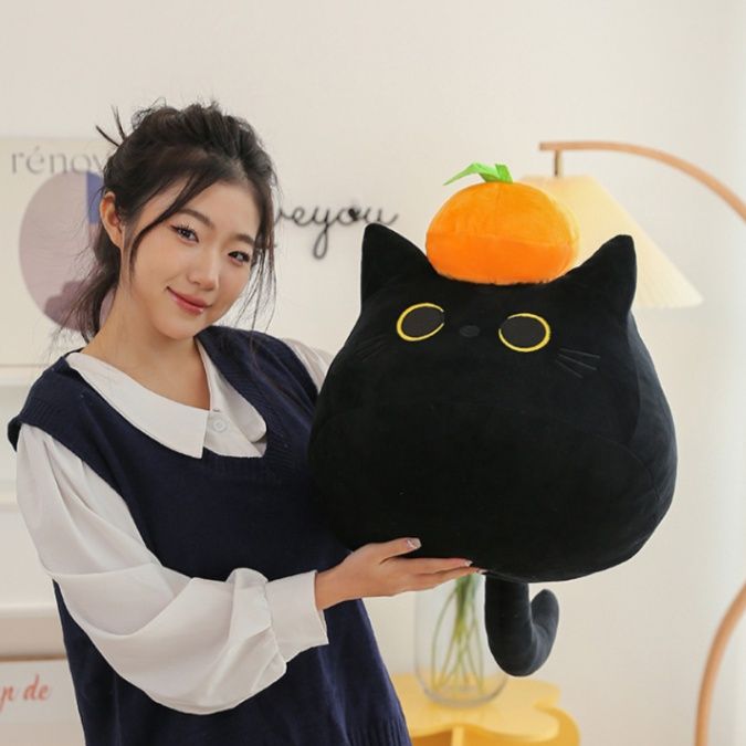 みかん帽子のまん丸おめめ黒猫ぬいぐるみ