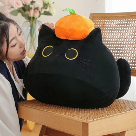 みかん帽子のまん丸おめめ黒猫ぬいぐるみ