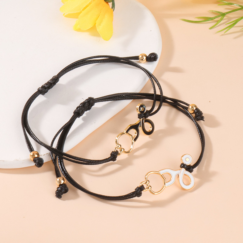 ペアブレスレット 手錠モチーフ編み込みコードペアブレスレット