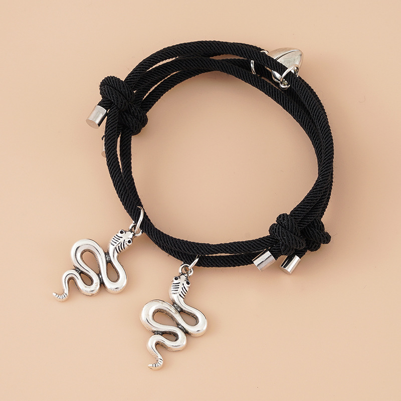 ペアブレスレット 蛇モチーフと揺れるハート調節可能紐編みブレスレット