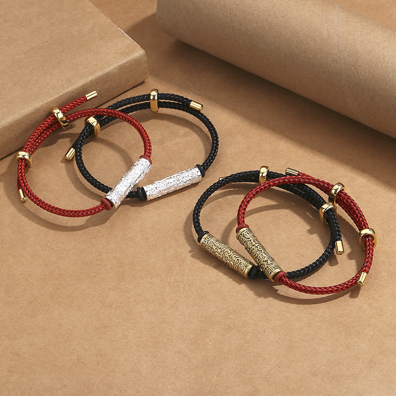 ペアブレスレット 編み込み紐と装飾金属筒が映えるペアブレスレット