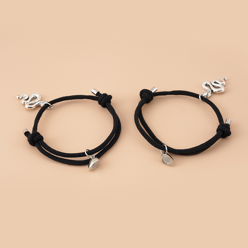 ペアブレスレット 蛇モチーフと揺れるハート調節可能紐編みブレスレット