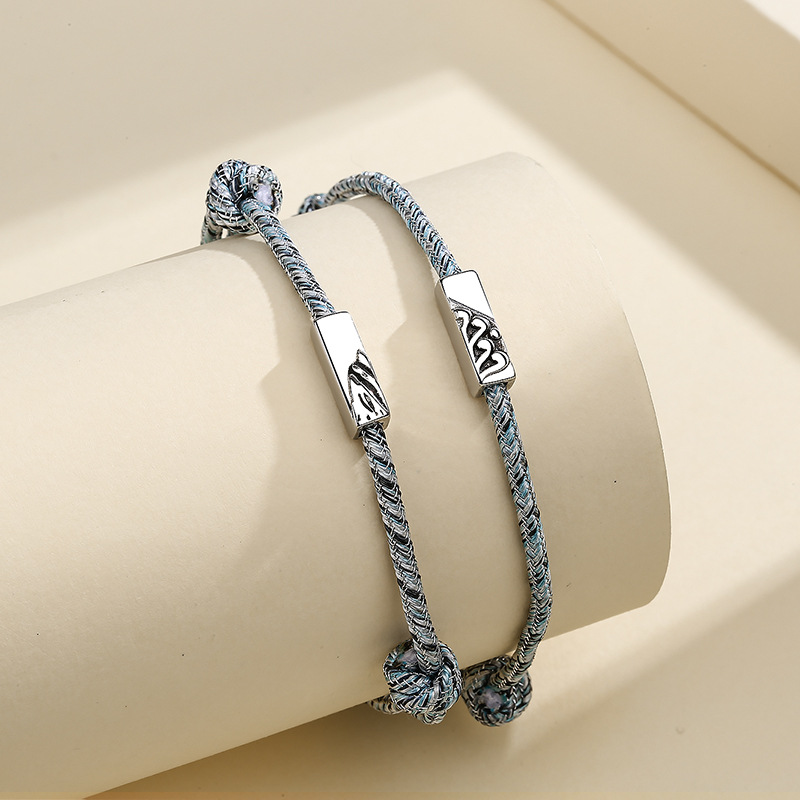 ペアブレスレット 絆を繋ぐ編み込みレザー結び玉ペアブレスレット