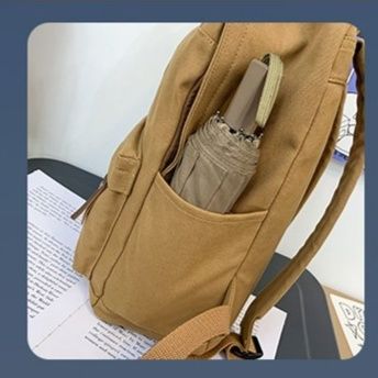 メンズリュック シンプル丸形バッジ付きキャンバスリュック