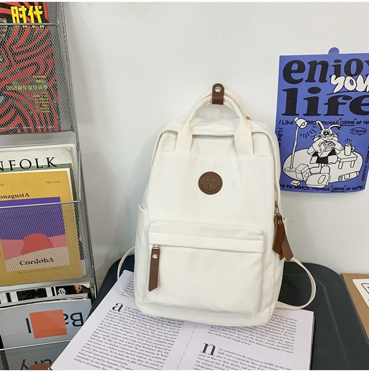 メンズリュック シンプル丸形バッジ付きキャンバスリュック