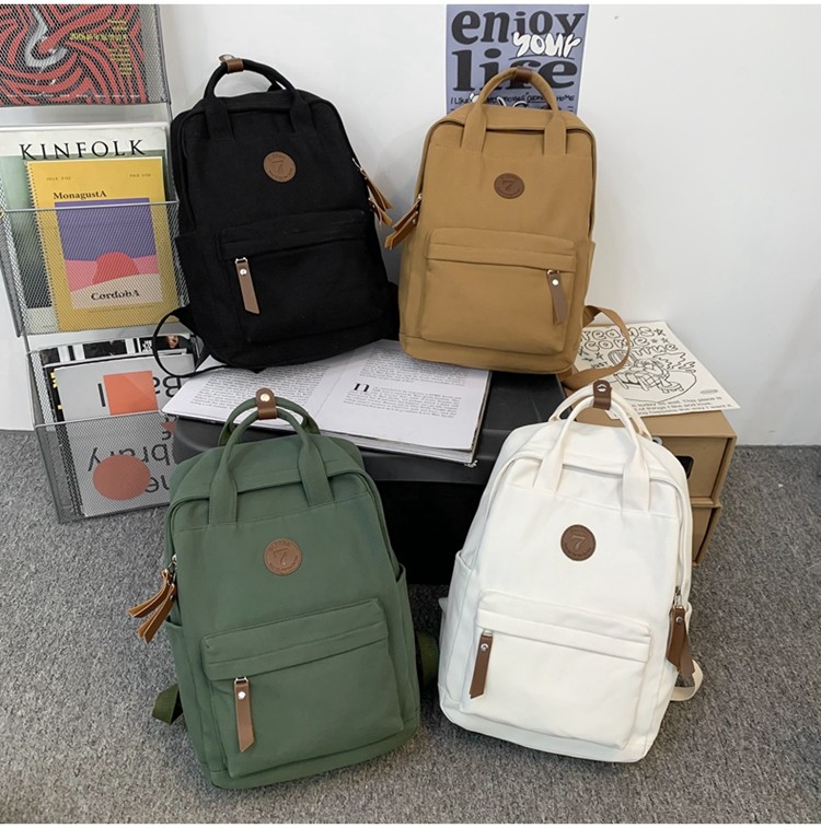 メンズリュック シンプル丸形バッジ付きキャンバスリュック