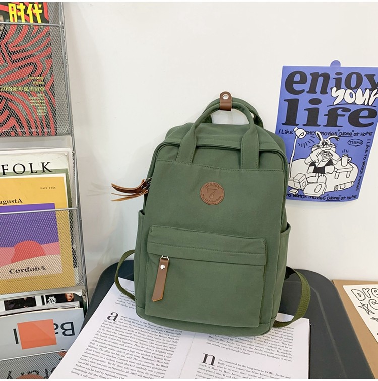 メンズリュック シンプル丸形バッジ付きキャンバスリュック