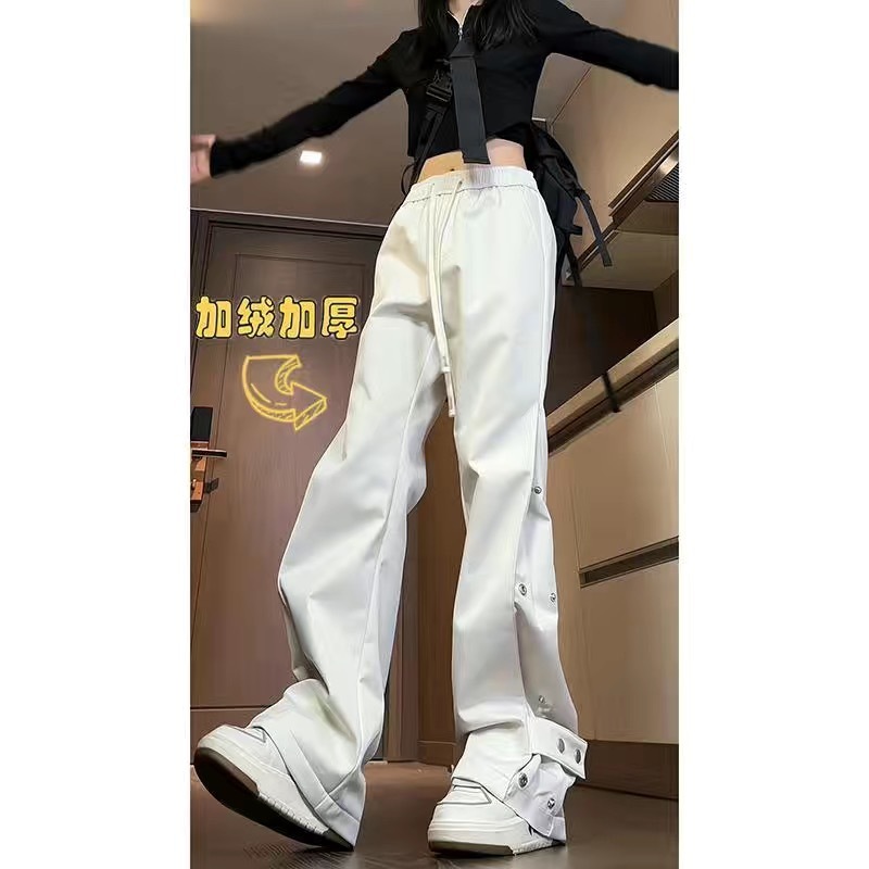 白パンツ スナップボタン付き裾広がりパンツ