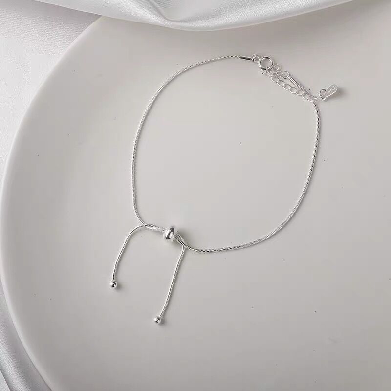 シルバーアクセサリー 流れる雫のリボンチョーカー