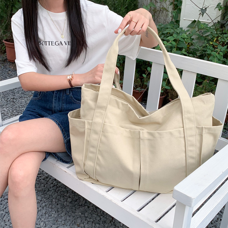 キャンバストート ゆとりポケット付き 多機能トートバッグ