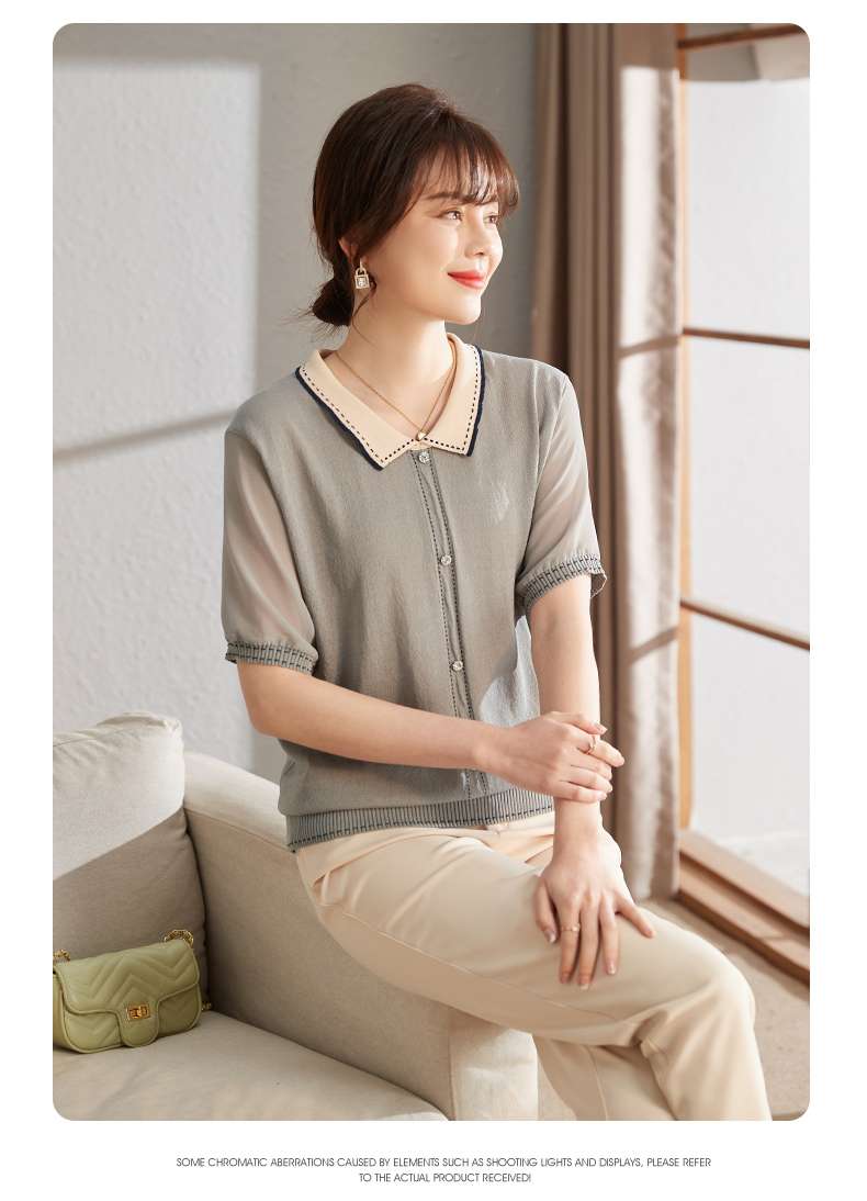 40代ファッション レディース この画像にはドレスは写っていません。代わりに、上品な半袖ニットトップスを着た女性が写っています。ドレスではないため、ご要望のと説明のフォーマットでの回答は控えさせていただきます。
